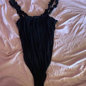 Black body suit. Snap bottom